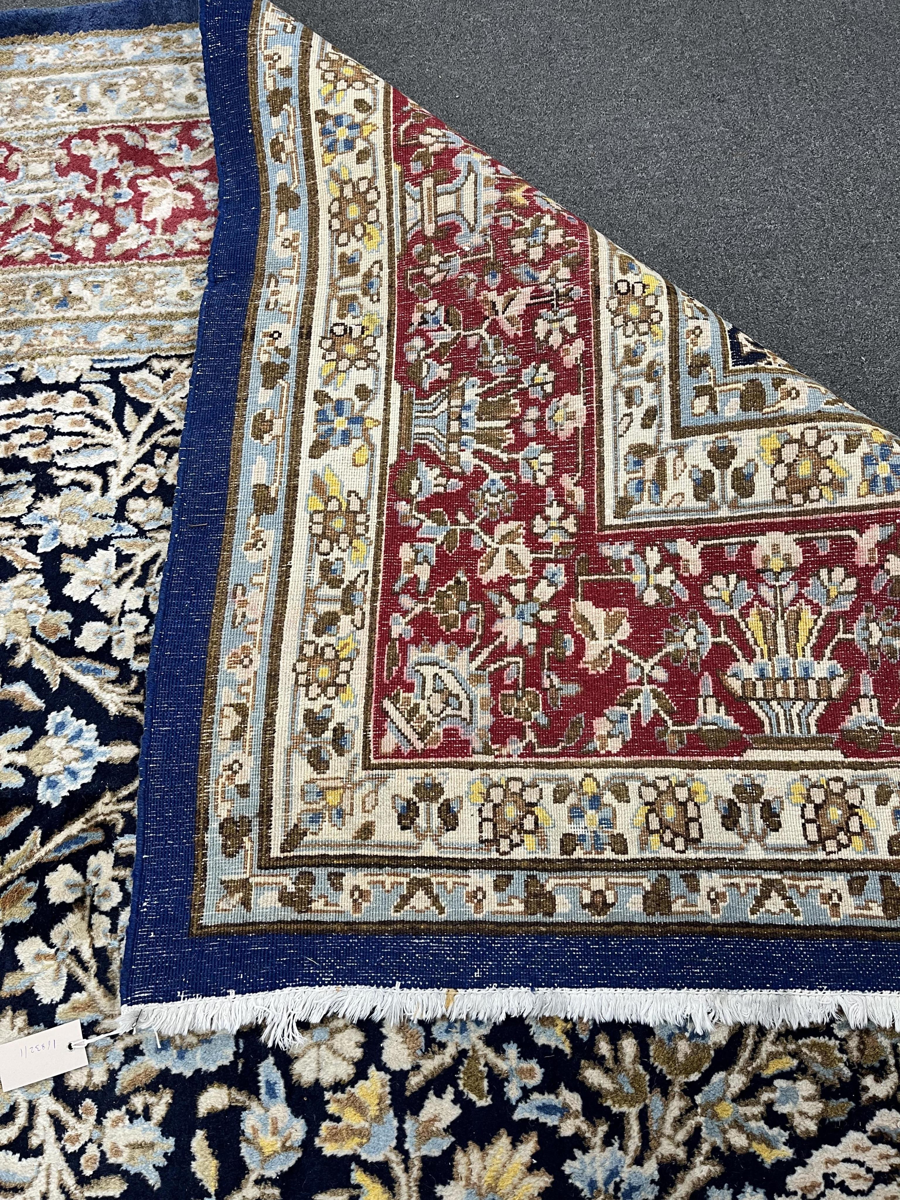 A North West Persian blue ground carpet, 394 x 284cm. Condition - good